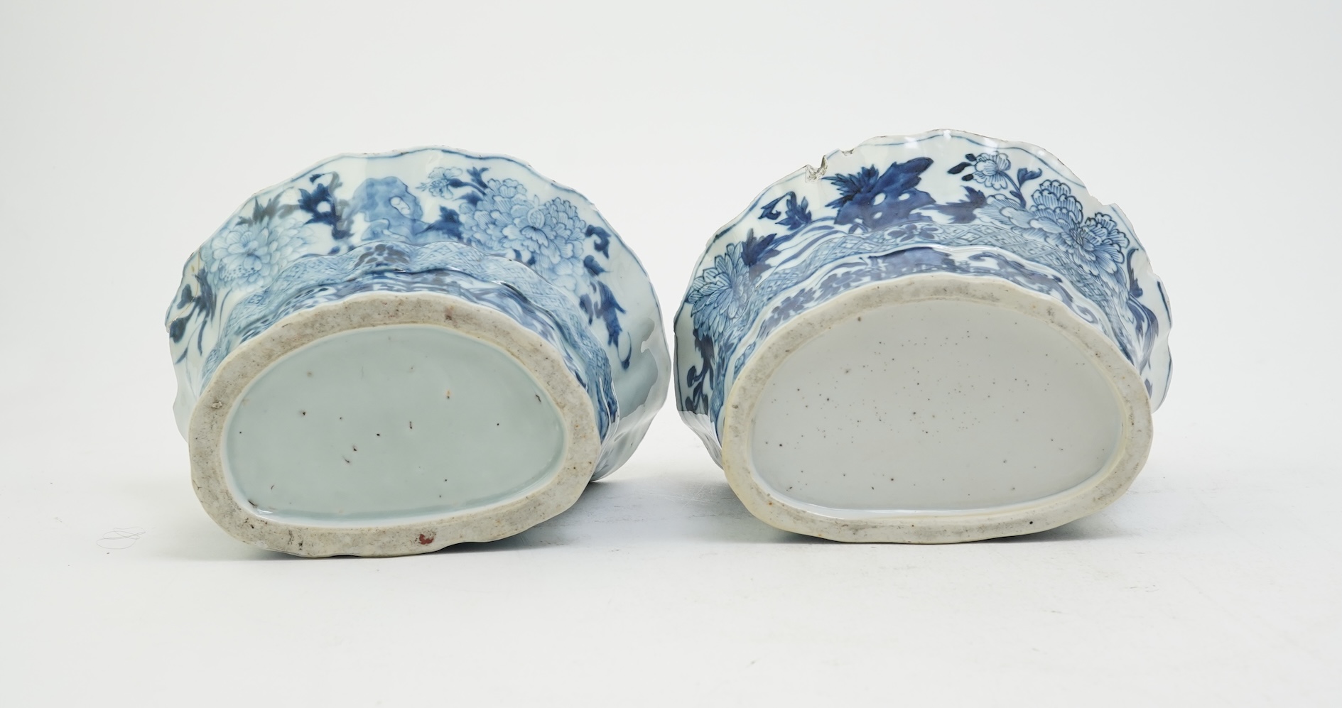 A pair of unusual Chinese export blue and white bough pots, after a Delft model, Qianlong period